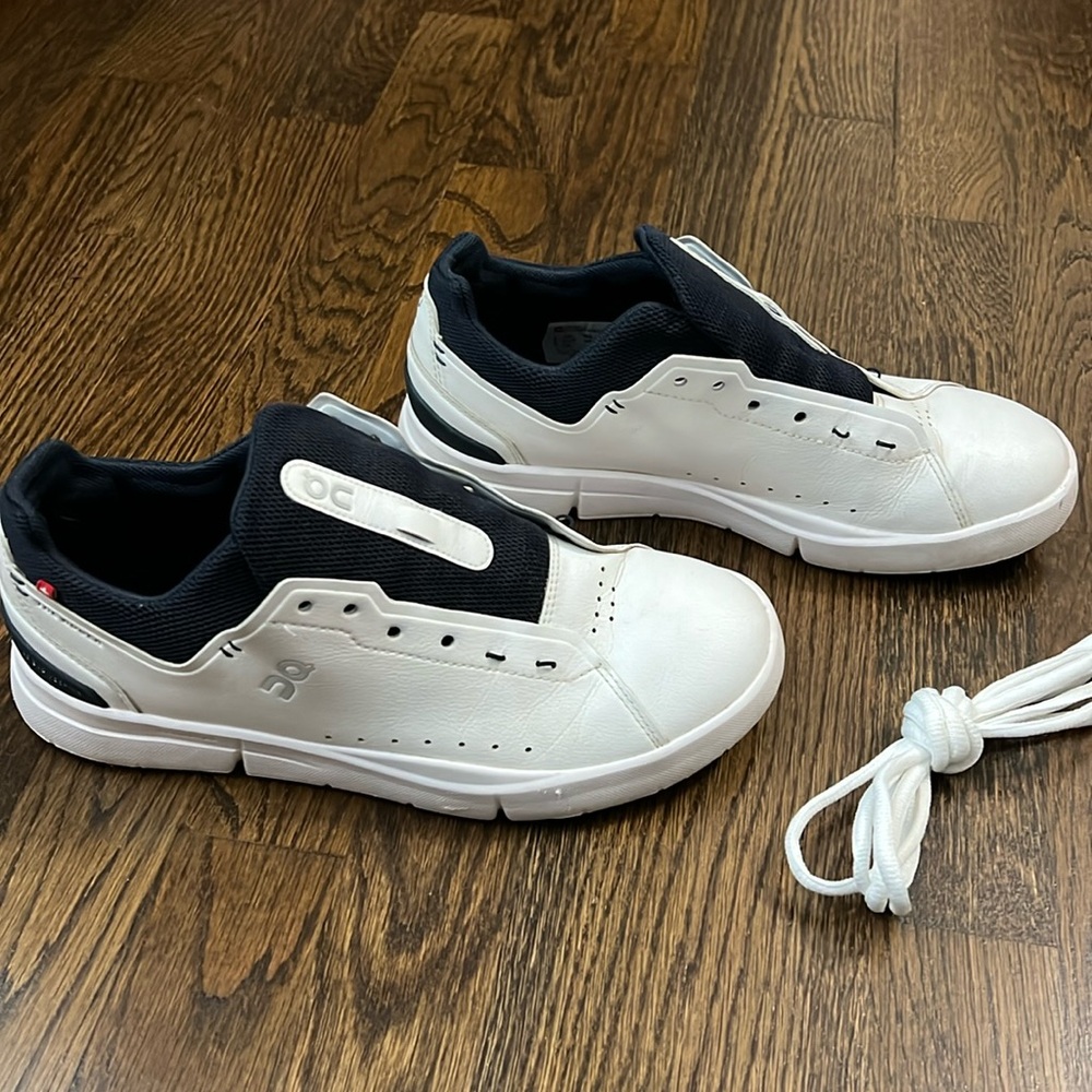 On Running White and Black Athletic Shoes